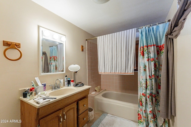 bathroom featuring tile patterned floors, shower / tub combo with curtain, and vanity