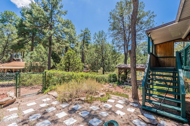 view of patio / terrace featuring fence and a gate