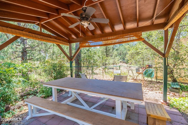 view of patio / terrace featuring a ceiling fan, fence, and a gazebo