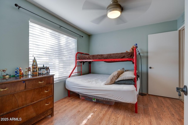 bedroom with ceiling fan and light hardwood / wood-style flooring