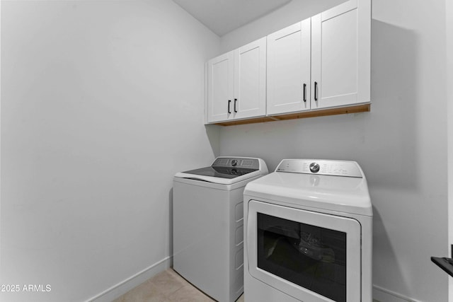 27510 N 30th Ln, Phoenix, AZ 85083 - laundry room with cabinet space, separate washer and dryer, baseboards, and light tile patterned floors