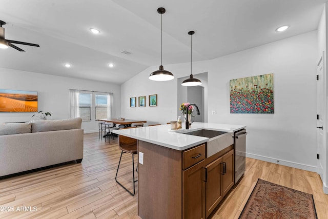 27510 N 30th Ln, Phoenix, AZ 85083 - kitchen with a ceiling fan, lofted ceiling, light wood finished floors, dishwasher, and an island with sink