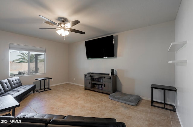 tiled living room with ceiling fan