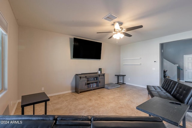 tiled living room featuring ceiling fan