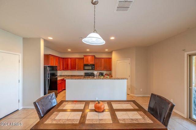 dining space featuring light tile patterned flooring