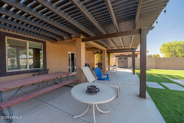 view of patio with a pergola and a storage unit