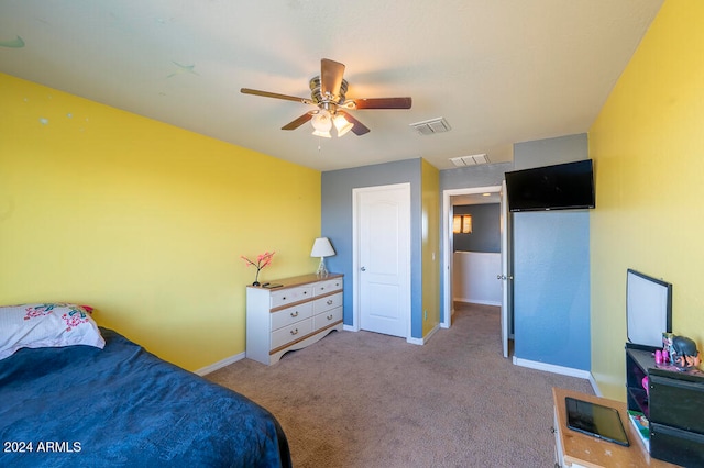 bedroom featuring light colored carpet and ceiling fan