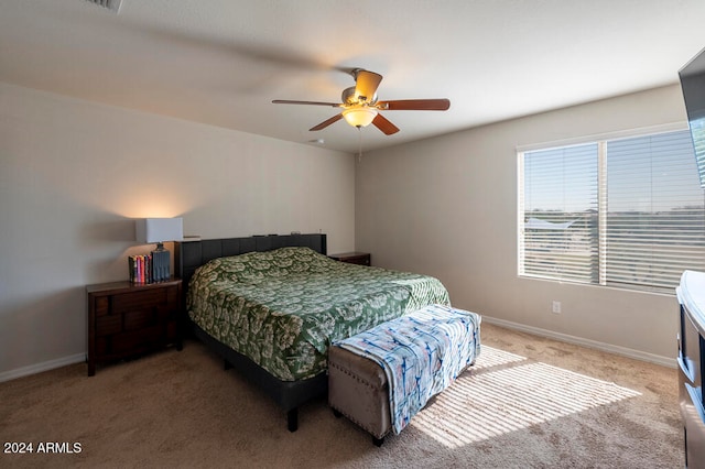 bedroom with ceiling fan and carpet floors