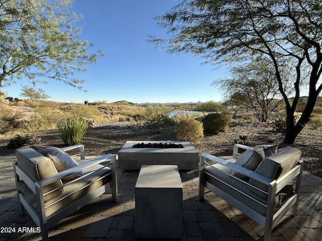 view of patio with an outdoor fire pit