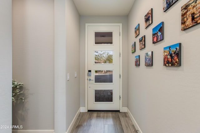 doorway with hardwood / wood-style floors