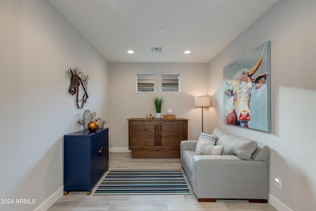 sitting room with light hardwood / wood-style flooring