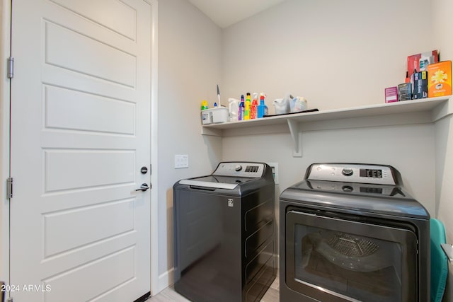 laundry room with separate washer and dryer