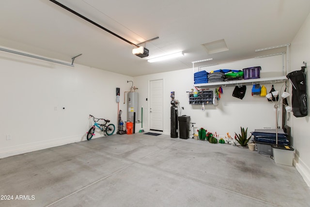 garage featuring electric water heater and a garage door opener