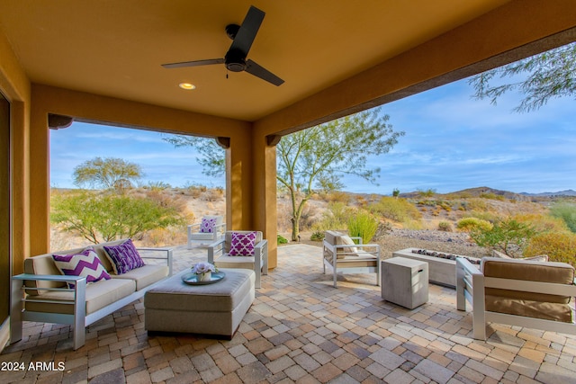 view of patio featuring an outdoor living space with a fire pit and ceiling fan