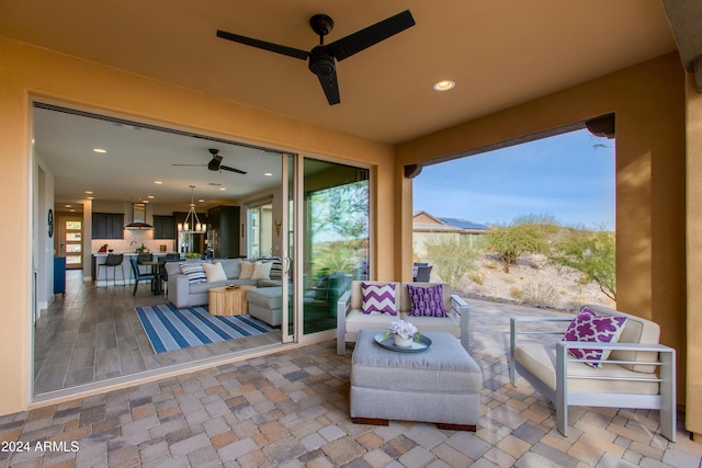 view of patio / terrace featuring ceiling fan and an outdoor hangout area