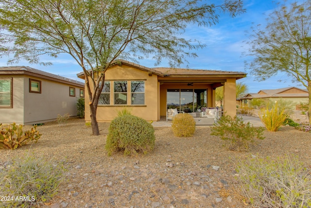 view of front of property featuring ceiling fan