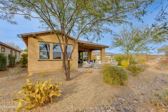 back of house featuring a patio