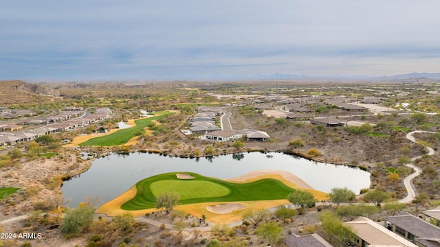 drone / aerial view with a water and mountain view