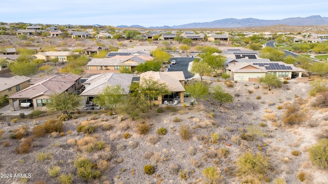 birds eye view of property with a mountain view