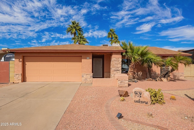 view of front of property featuring a garage, stone siding, concrete driveway, and stucco siding