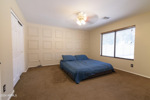 carpeted bedroom featuring ceiling fan