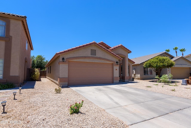 view of front of property with a garage