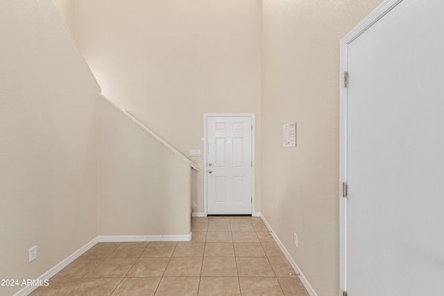 hallway with light tile patterned flooring