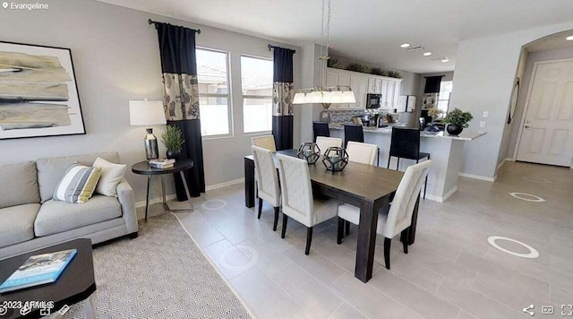 dining area with light tile patterned floors