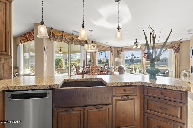 kitchen with ceiling fan, stainless steel dishwasher, decorative light fixtures, and sink