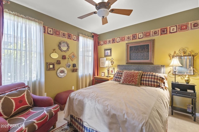 carpeted bedroom featuring ceiling fan