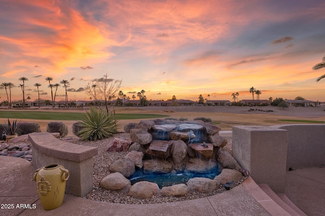 view of yard at dusk