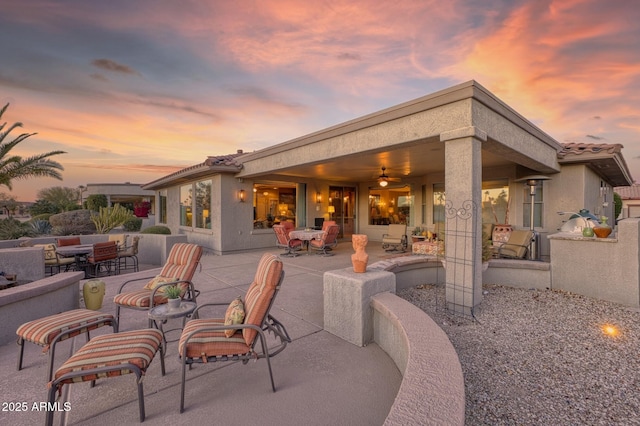 patio terrace at dusk with ceiling fan