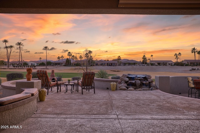 view of patio terrace at dusk