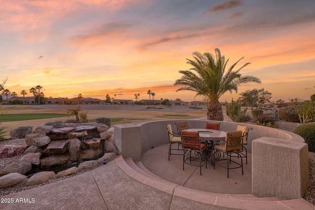 view of patio terrace at dusk