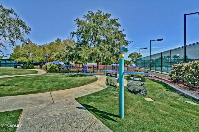 view of home's community with a playground and a lawn