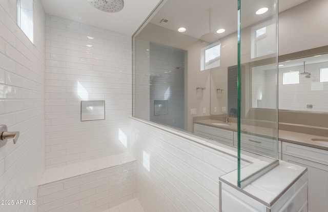 full bath with recessed lighting, walk in shower, and vanity