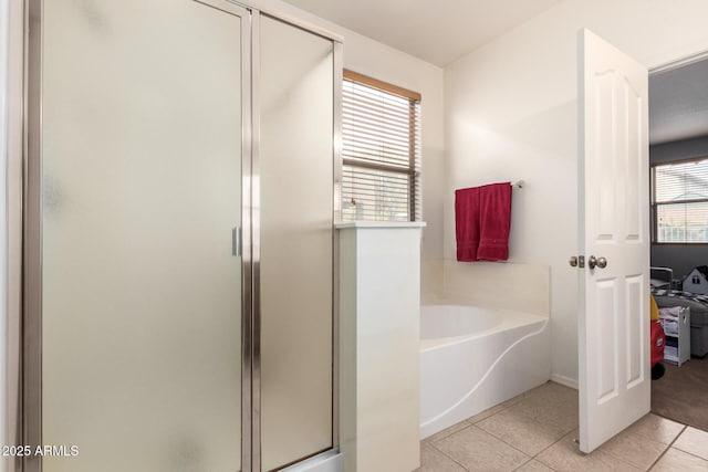 bathroom with plus walk in shower and tile patterned floors