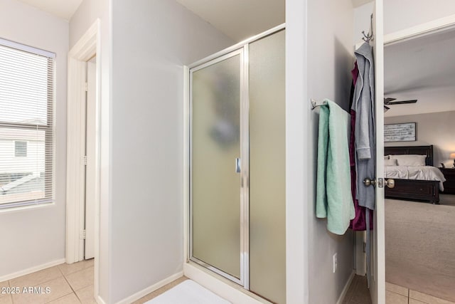 bathroom with tile patterned floors and walk in shower