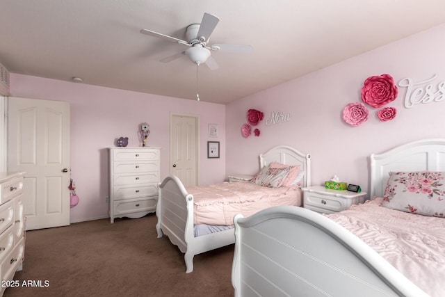 bedroom with ceiling fan and dark colored carpet