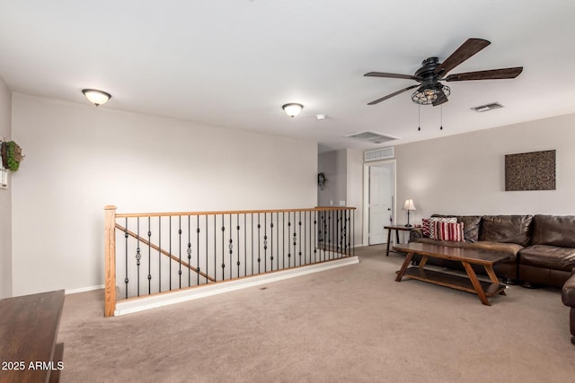 living room with ceiling fan and carpet flooring