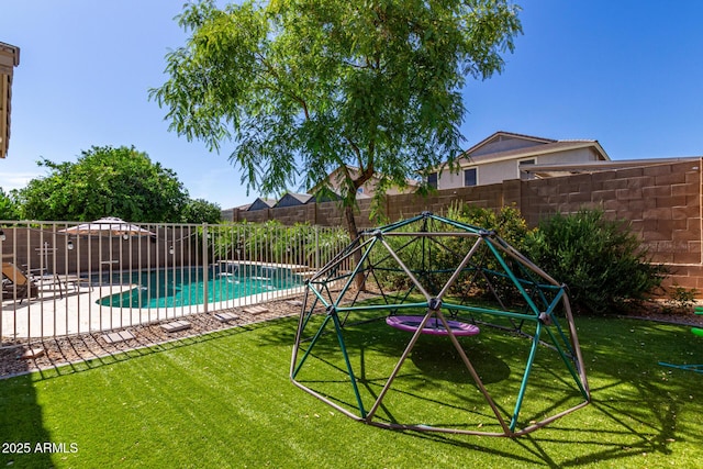 view of swimming pool featuring a lawn and a patio area