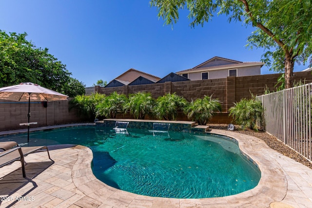 view of swimming pool with a patio and pool water feature