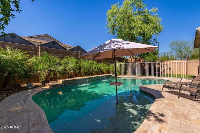 view of pool featuring pool water feature and a patio