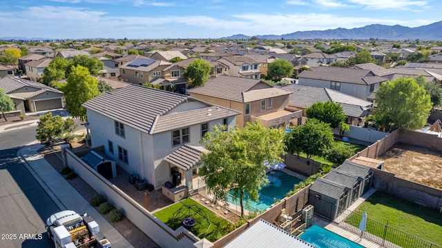 birds eye view of property with a mountain view