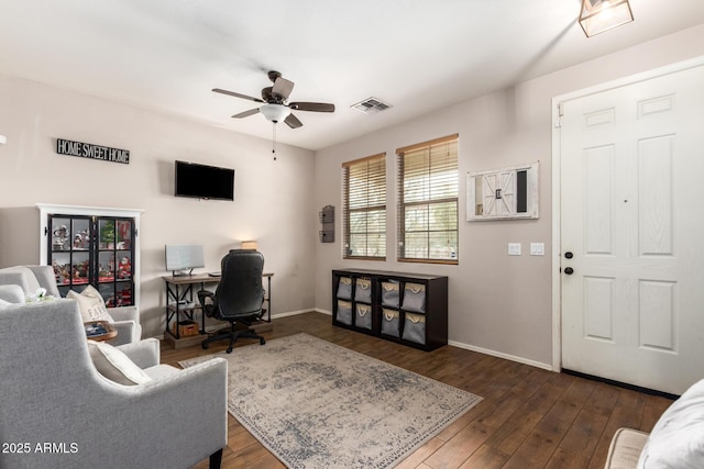 living room with dark wood-type flooring and ceiling fan