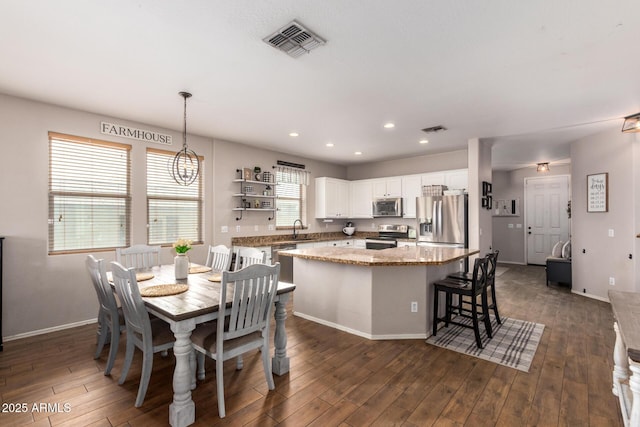 dining room featuring dark hardwood / wood-style floors and sink