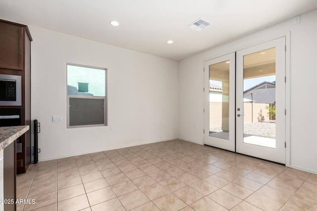 6331 W Desert Blossom Way, Florence, AZ 85132 - unfurnished room featuring light tile patterned flooring, french doors, and recessed lighting