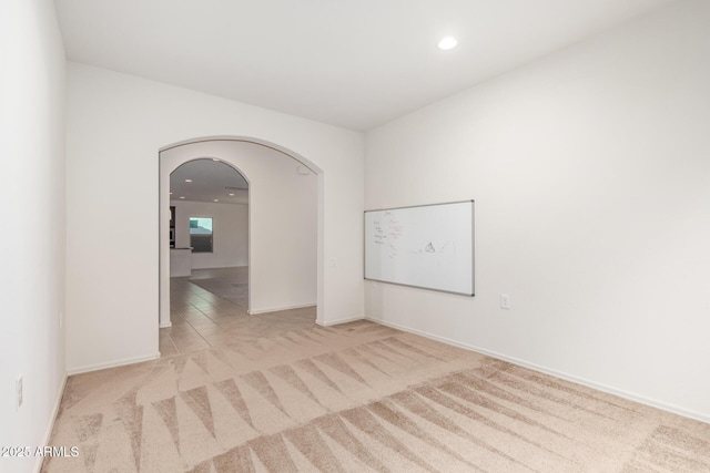 6331 W Desert Blossom Way, Florence, AZ 85132 - carpeted spare room with arched walkways, recessed lighting, and baseboards