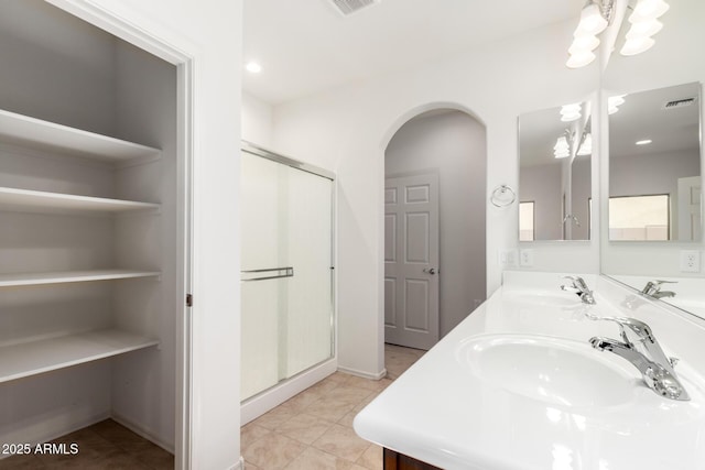 6331 W Desert Blossom Way, Florence, AZ 85132 - full bathroom with double vanity, a stall shower, and recessed lighting