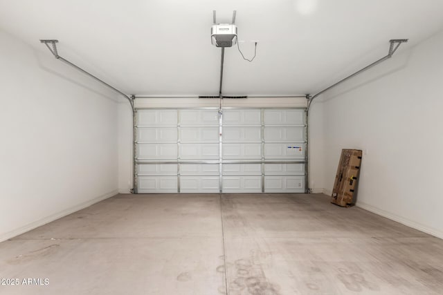 6331 W Desert Blossom Way, Florence, AZ 85132 - garage with a garage door opener and baseboards